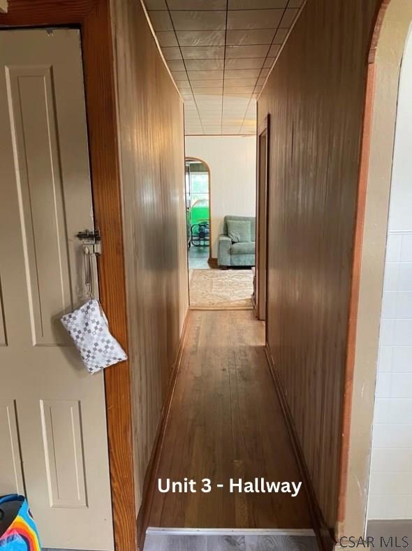 1804 Somerset Ave, Windber, PA 15963 - hall with arched walkways, wood finished floors, and wooden walls