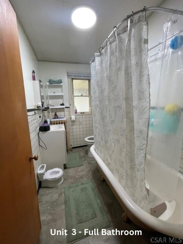 1804 Somerset Ave, Windber, PA 15963 - full bathroom with toilet, shower / bath combo, and tile walls