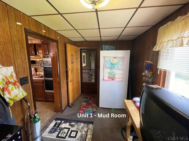 1804 Somerset Ave, Windber, PA 15963 - kitchen with wood walls, carpet flooring, a paneled ceiling, freestanding refrigerator, and double oven
