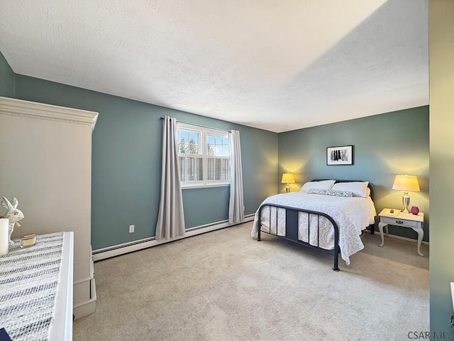 bedroom featuring a textured ceiling, baseboards, carpet floors, and a baseboard radiator