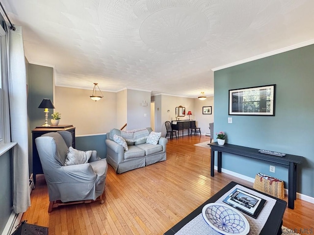 living room featuring light wood-type flooring, baseboards, a textured ceiling, and crown molding