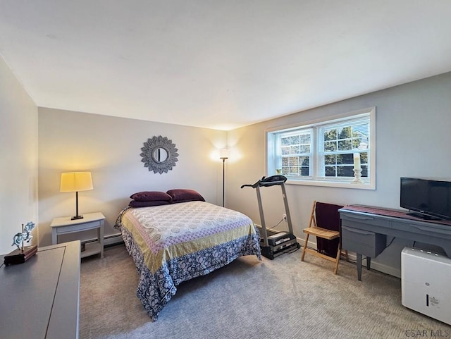 bedroom featuring carpet flooring and baseboards