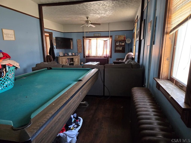 playroom with ceiling fan, pool table, dark wood-type flooring, and a textured ceiling