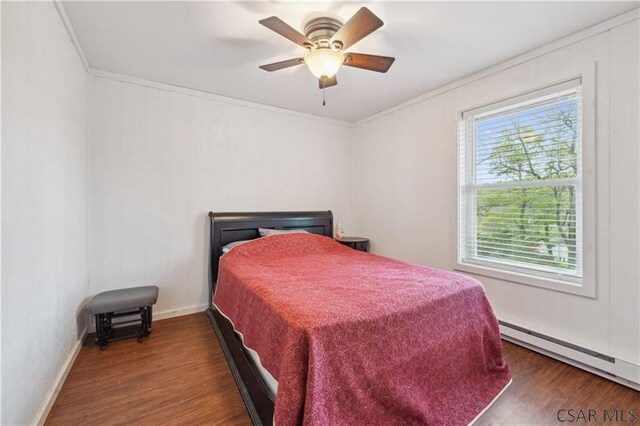 1036 Causeway Dr, Friedens, PA 15541 - bedroom featuring a baseboard heating unit, wood finished floors, baseboards, ornamental molding, and a ceiling fan