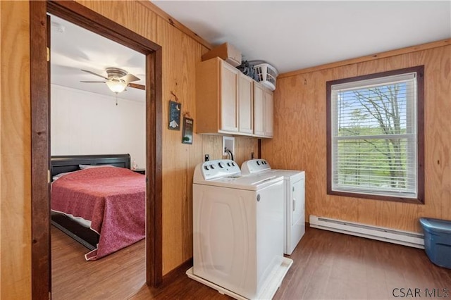 1036 Causeway Dr, Friedens, PA 15541 - washroom featuring baseboard heating, cabinet space, washer and dryer, dark wood-type flooring, and wooden walls