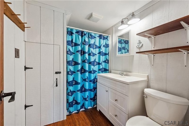 1036 Causeway Dr, Friedens, PA 15541 - bathroom featuring wood finished floors, vanity, toilet, and a shower with shower curtain
