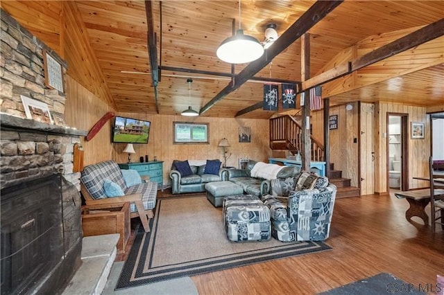 1036 Causeway Dr, Friedens, PA 15541 - living area featuring a fireplace, wood finished floors, stairway, wooden walls, and wooden ceiling
