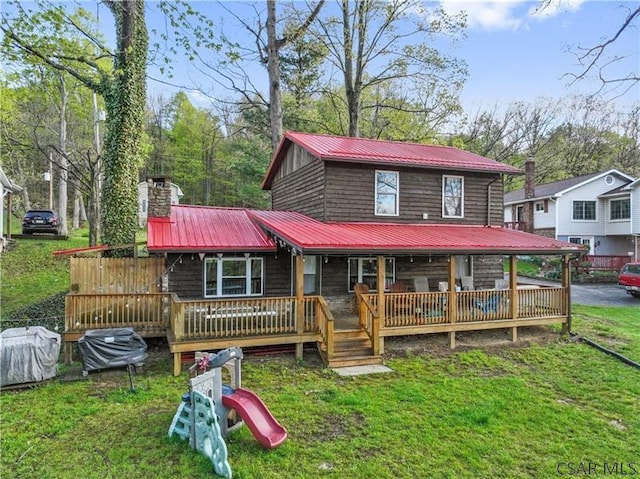 1036 Causeway Dr, Friedens, PA 15541 - view of front of property featuring metal roof, a front yard, and a chimney