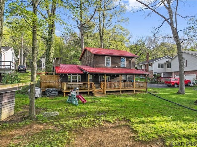 1036 Causeway Dr, Friedens, PA 15541 - back of property featuring metal roof, a yard, a chimney, and driveway