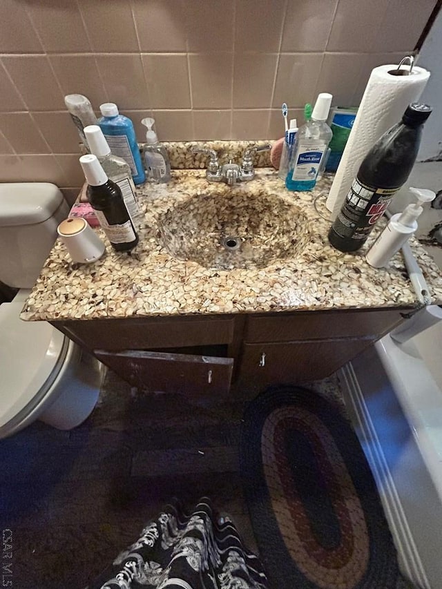 128 15th St, New Florence, PA 15944 - bathroom with tasteful backsplash, vanity, and tile walls