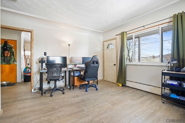 office with ornamental molding, a baseboard radiator, and wood finished floors