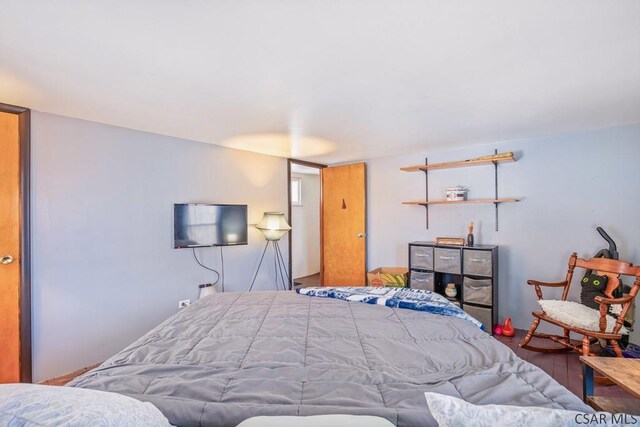 bedroom with wood finished floors