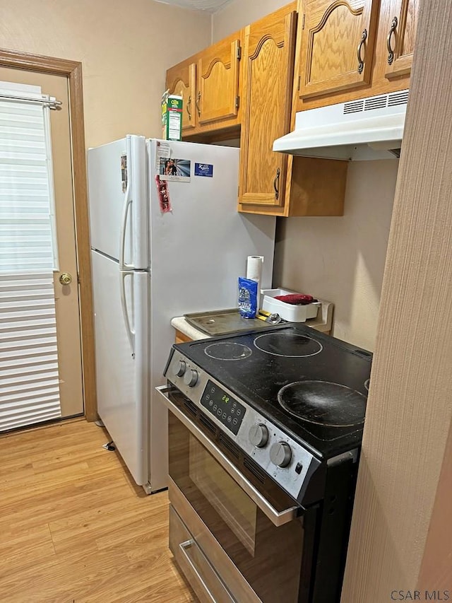 kitchen with light wood-type flooring and stainless steel electric range oven