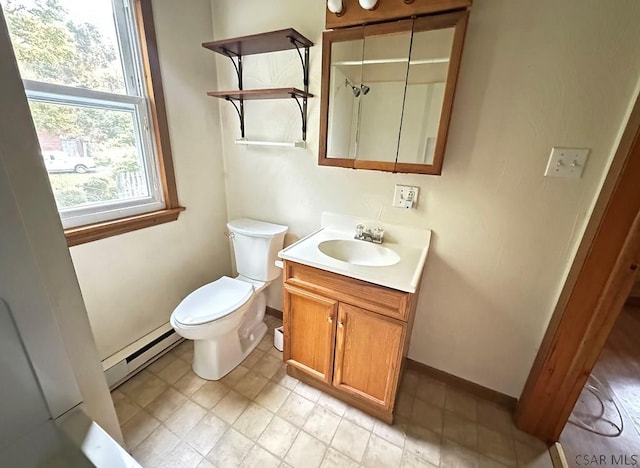 bathroom featuring vanity, toilet, and a baseboard heating unit