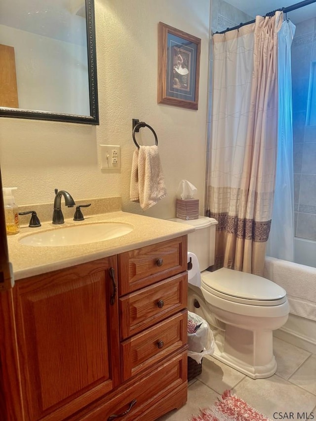 full bathroom with vanity, shower / bath combo, tile patterned flooring, and toilet