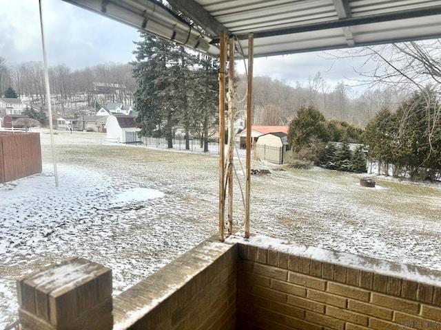 view of yard layered in snow