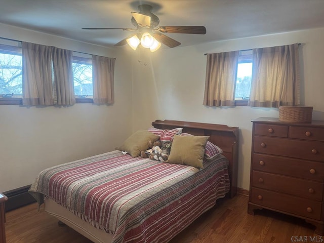 bedroom featuring ceiling fan and wood finished floors