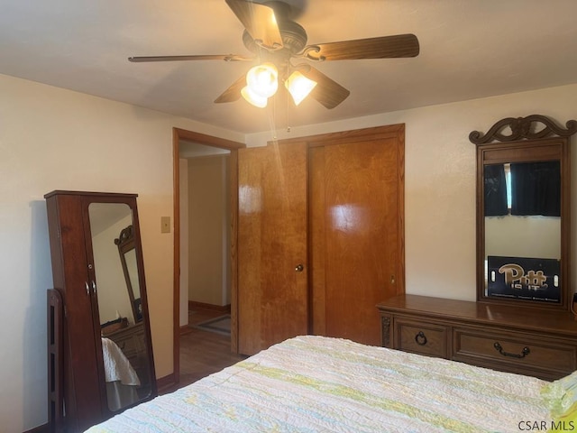 bedroom featuring ceiling fan and a closet