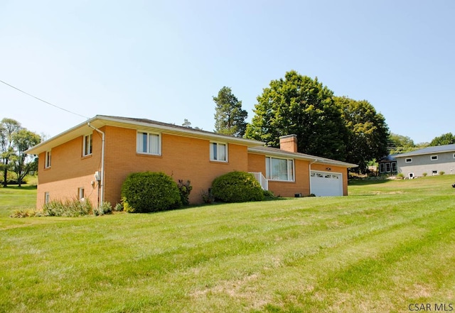 view of property exterior featuring a garage and a lawn