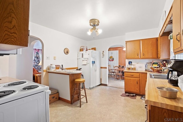 kitchen with sink and white appliances