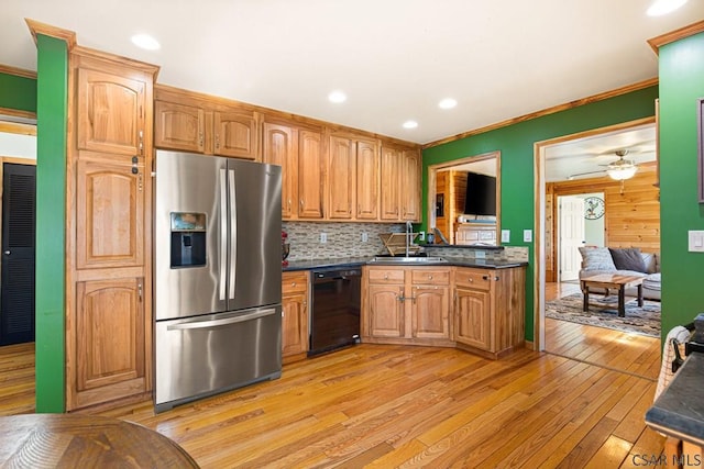 1070 Huckleberry Hwy, Central City, PA 15926 - kitchen with stainless steel refrigerator with ice dispenser, dark countertops, light wood-type flooring, a sink, and black dishwasher