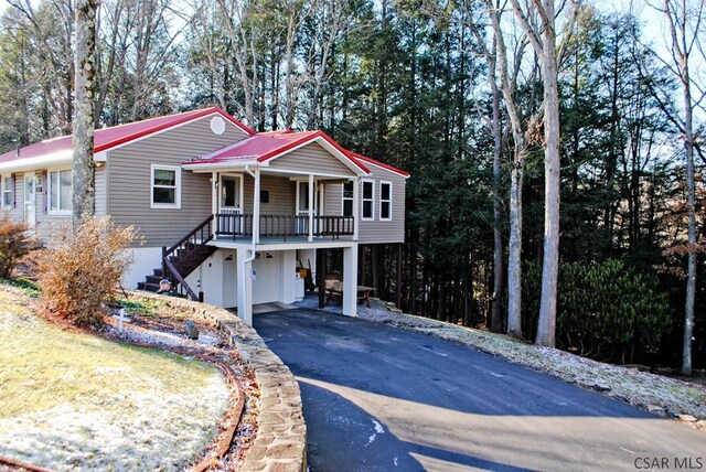 view of front of property with a garage and a porch