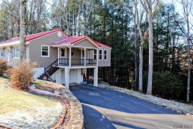 view of front of property with a garage and a porch