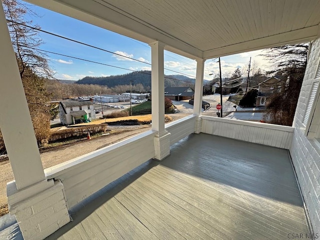 unfurnished sunroom with wooden ceiling