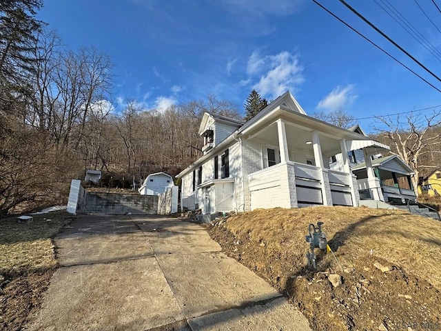 view of side of property with a porch