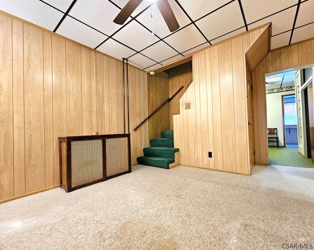 1315 Maryland Ave, Johnstown, PA 15906 - finished below grade area with ceiling fan, wood walls, carpet, and stairway