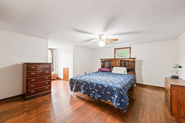 bedroom featuring dark hardwood / wood-style floors and ceiling fan