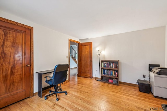 home office with light wood-type flooring