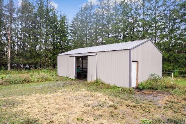 view of outbuilding with a lawn