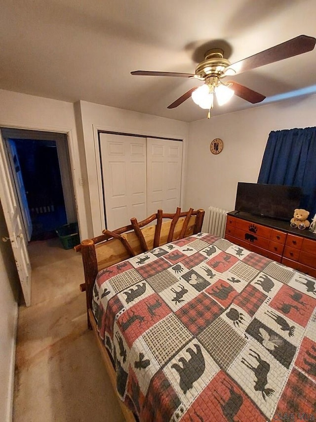 bedroom featuring a ceiling fan, a closet, and carpet flooring