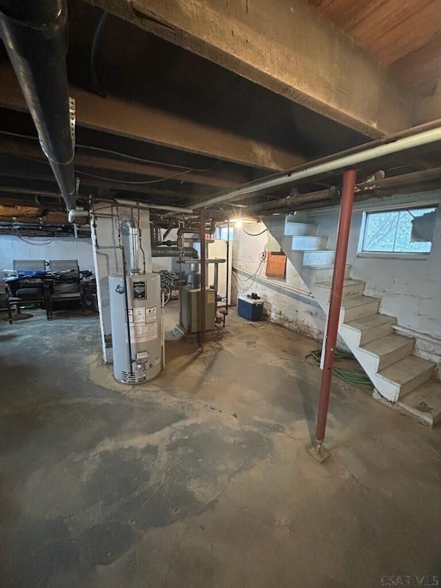 below grade area with stairs and gas water heater