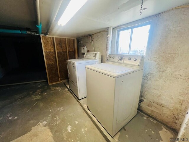 washroom with washer and dryer