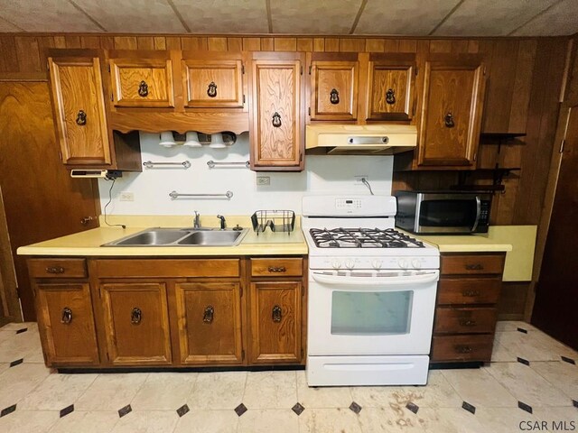 kitchen with sink and white range with gas stovetop