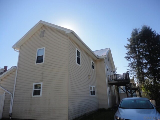 view of side of property with a deck