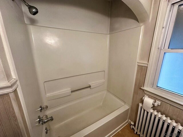 1750 Scalp Ave, Johnstown, PA 15904 - bathroom featuring radiator heating unit and shower / tub combination