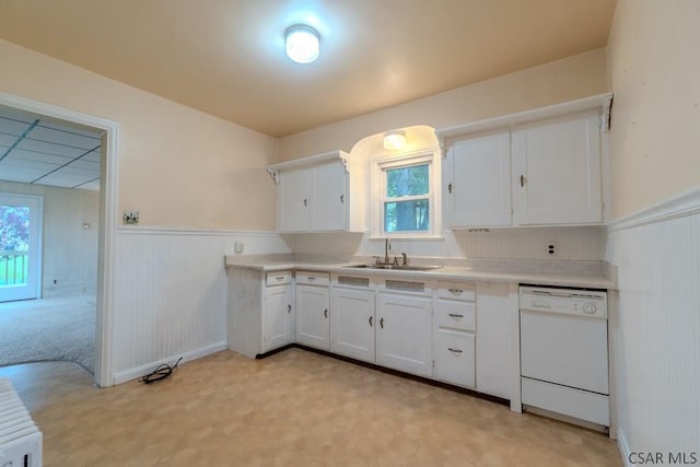 1750 Scalp Ave, Johnstown, PA 15904 - kitchen featuring white dishwasher, a sink, a wainscoted wall, white cabinetry, and light countertops