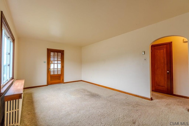 1750 Scalp Ave, Johnstown, PA 15904 - empty room featuring arched walkways, light colored carpet, and baseboards