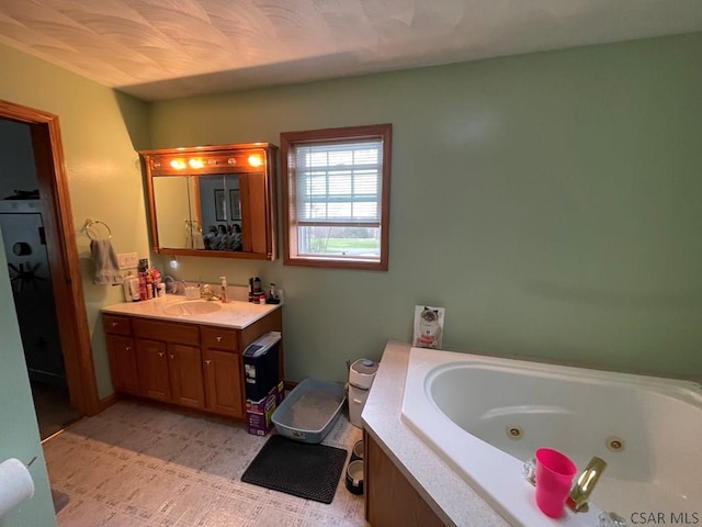 full bath with a tub with jets and vanity