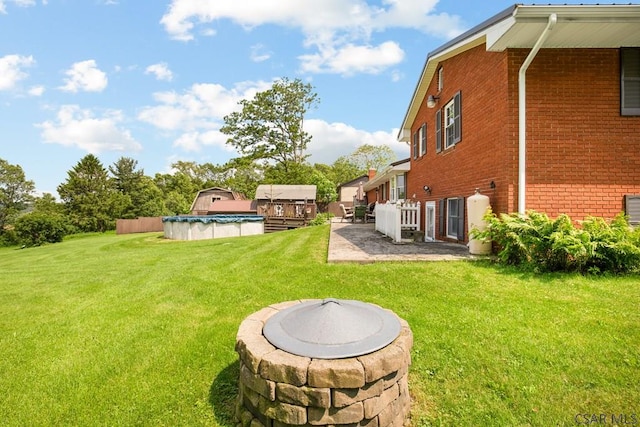258 Samuels Rd, Somerset, PA 15501 - view of grassy yard featuring a covered pool and a patio area