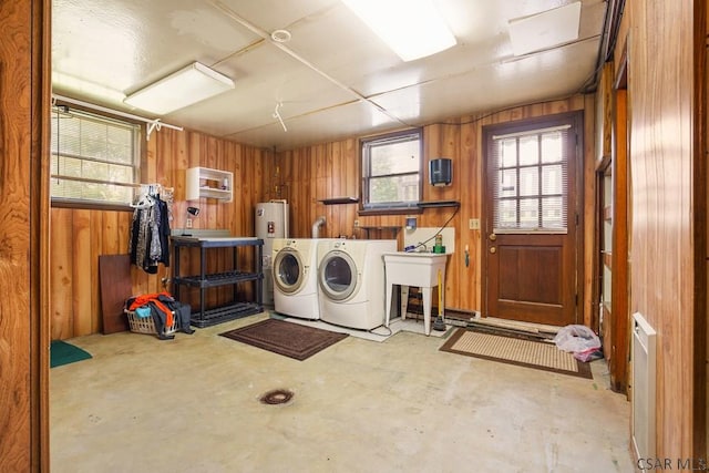 258 Samuels Rd, Somerset, PA 15501 - laundry room with washing machine and clothes dryer, wooden walls, and water heater