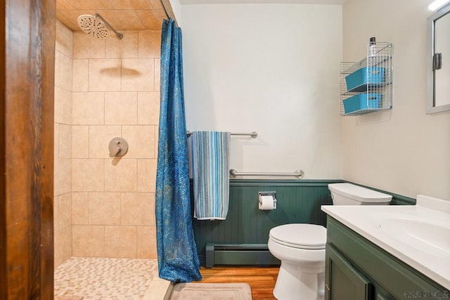 258 Samuels Rd, Somerset, PA 15501 - bathroom featuring a baseboard radiator, a shower stall, vanity, wainscoting, and wood finished floors