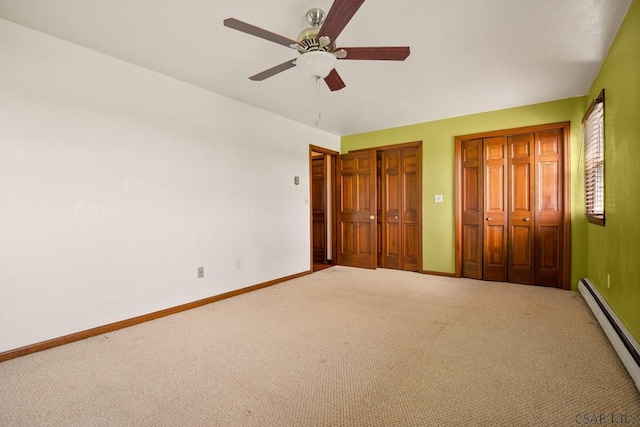 258 Samuels Rd, Somerset, PA 15501 - unfurnished bedroom with a baseboard heating unit, carpet, multiple closets, and ceiling fan