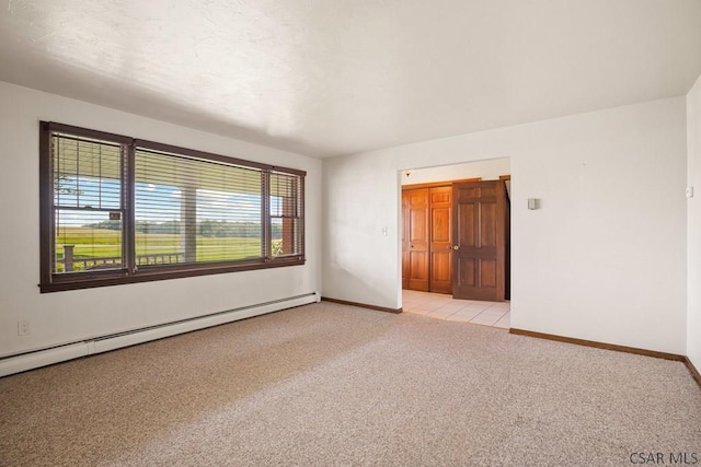 258 Samuels Rd, Somerset, PA 15501 - empty room with light colored carpet and baseboard heating