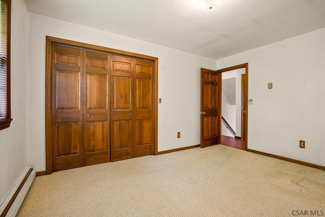 258 Samuels Rd, Somerset, PA 15501 - unfurnished bedroom featuring a baseboard heating unit, carpet flooring, and a closet