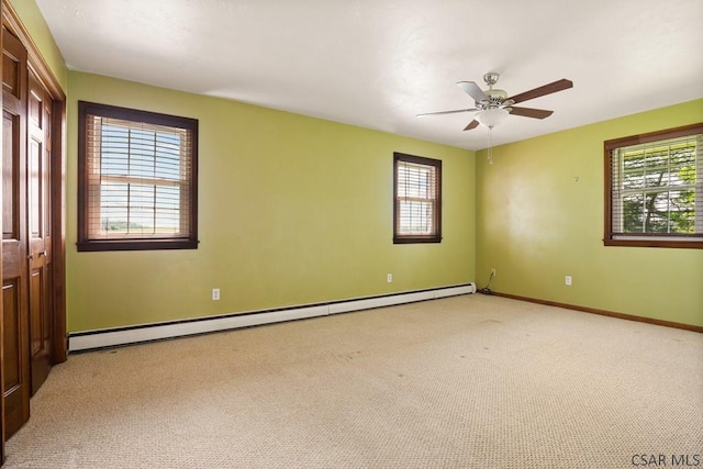 258 Samuels Rd, Somerset, PA 15501 - empty room with a baseboard heating unit, a ceiling fan, and light carpet