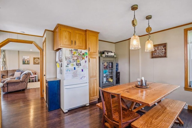 1139 Chickentown Rd, Somerset, PA 15501 - kitchen featuring arched walkways, decorative light fixtures, ornamental molding, dark wood-style floors, and freestanding refrigerator
